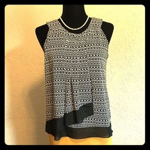 Medium black and white patterned dress shirt.